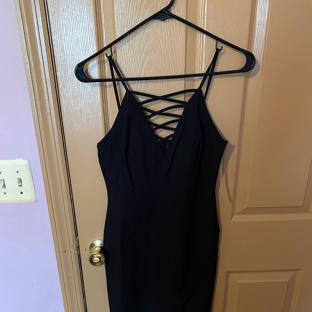 Black mini dress with cross cross detailing on bust